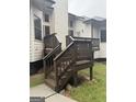 Wooden back deck and stairs of home during a rain shower at 2360 Barrington Trace Sw Cir, South Fulton, GA 30331