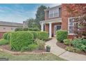 Well-maintained yard with trimmed hedges around the walkway at 500 Merrill Ln, Peachtree City, GA 30269