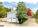 Spacious two-car garage with ample parking and storage space at 165 Longshore Way, Fayetteville, GA 30215