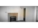 Living room showing a brick fireplace with a white mantel at 2916 Memorial Se Dr, Atlanta, GA 30317