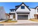 Charming two-story home with a brick exterior, well-manicured lawn, and a two-car garage at 1240 Hayes Sq, Peachtree City, GA 30269