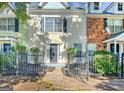 Charming walkway leads to townhome with beautiful landscaping and fenced yard at 488 N Jeff Davis Dr, Fayetteville, GA 30214