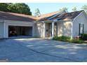 Long driveway leading to a two car garage with red jeep and inviting front entrance at 175 Camry Ln, Grayson, GA 30017