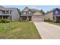 Attractive two-story home with a manicured lawn, showcasing a brick and siding exterior design at 9046 Holder Rd, Locust Grove, GA 30248