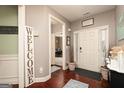 Inviting foyer with hardwood floors, neutral paint, and a view of other rooms at 2256 Long Bow Chase Nw, Kennesaw, GA 30144