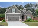 Charming single-Gathering home featuring a 2-car garage, brick accents, and well-manicured landscaping at 2256 Long Bow Chase Nw, Kennesaw, GA 30144