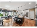 Spacious kitchen featuring a large island, modern appliances, and a breakfast nook with backyard views at 162 Daltree Ct, Marietta, GA 30068