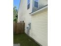 The house features a vinyl siding exterior and a wooden fence enclosing the yard at 2208 Crossrail Dr, Atlanta, GA 30349