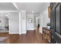 Elegant entryway with hardwood floors, crown molding, and a view into the dining room at 3400 Dencrest Se Ct, Smyrna, GA 30080