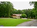 Charming single Gathering home with attached garage, long drive and ample green space at 150 Sandy Ridge Trl, Fayetteville, GA 30214