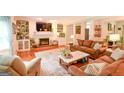 Cozy living room with fireplace, built-in shelving, and comfortable seating arrangement at 150 Sandy Ridge Trl, Fayetteville, GA 30214