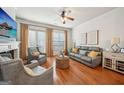 Comfortable living room with hardwood floors, a fireplace, and ample seating for relaxation at 1858 Preserve Way, Atlanta, GA 30341
