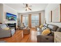 Inviting living room with hardwood floors, a fireplace, and plenty of natural light from the windows at 1858 Preserve Way, Atlanta, GA 30341