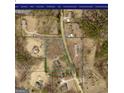 An aerial view of the property showing its location and surrounding land in a rural neighborhood at 920 Courthouse Rd, Temple, GA 30179