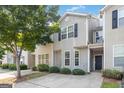 Attractive townhome exterior with inviting front entrance, manicured landscaping, and a welcoming curb appeal at 2268 Nicole Dr, Hampton, GA 30228