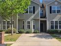 Inviting townhome featuring a well-manicured lawn and charming curb appeal, perfect for comfortable living at 2268 Nicole Dr, Hampton, GA 30228