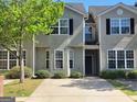 Inviting townhome featuring a well-manicured lawn and charming curb appeal, perfect for comfortable living at 2268 Nicole Dr, Hampton, GA 30228