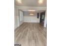 Dining room with hardwood floors, decorative molding, and an elegant chandelier at 1049 Homer Ln, Stockbridge, GA 30281