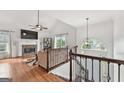 Bright and airy living room with fireplace, hardwood floors, and staircase at 4733 Julian Way, Acworth, GA 30101