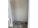 Entryway featuring tiled flooring and a storm door leading to the exterior at 135 Courtyard Ln, Fayetteville, GA 30215