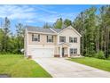 Beautiful two-story home with a two-car garage, situated on a well-manicured lawn at 210 Jenny Ct, Grantville, GA 30220