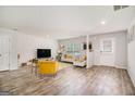 Spacious living room with wood flooring, recessed lighting, and neutral wall colors at 210 Jenny Ct, Grantville, GA 30220