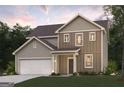 Inviting two-story home featuring well-maintained lawn and attached two car garage at 7223 Lacey Dr # 146, Douglasville, GA 30134