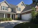 Charming two-story home with brick accents, manicured landscaping, and a spacious driveway at 1031 Jordan Rd, Dacula, GA 30019