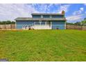 Expansive backyard with a white deck, perfect for outdoor entertaining and relaxation at 108 Country Acres Ct, Mcdonough, GA 30253