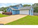 Spacious two-car garage and long driveway at 108 Country Acres Ct, Mcdonough, GA 30253
