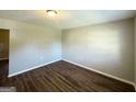 Bright, vacant bedroom with sleek, wood-look floors and neutral walls at 4039 Codel Nw St, Atlanta, GA 30331