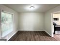 Dining room featuring new wood floors and natural light at 3670 Broadview Ct, Decatur, GA 30032