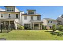 Nice backyard with green lawn, metal fence, and sunroom addition at 4137 Avid Park, Marietta, GA 30062