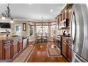 Beautiful kitchen with custom cabinets, stainless steel appliances, granite counters, and a breakfast nook with natural light at 409 Brandy Ln, Mcdonough, GA 30253