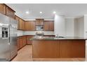 Well-equipped kitchen with stainless steel appliances, wood cabinets, and a large island at 1300 Hopkins Dr, Decatur, GA 30033