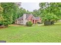Attractive brick home with a spacious yard and lush greenery at 835 Virginia Parks, Fayetteville, GA 30215