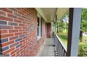 Side view of porch showing brickwork and painted posts at 766 Virginia Cir, Forest Park, GA 30297