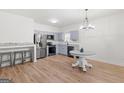 Modern kitchen with stainless steel appliances, light gray cabinets, and butcher block countertops at 23 Skyland W Dr, Locust Grove, GA 30248