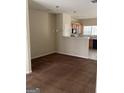 Open-concept living room with brown carpet and view of the kitchen at 8170 Oakley Cir # 2, Union City, GA 30291