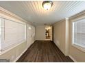 Bright living area with hardwood floors, white brick accents, and multiple windows for abundant natural light at 3115 Pinehill Dr, Decatur, GA 30032