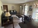 Cozy living room with comfortable seating, natural light, and an inviting atmosphere at 5125 Flakes Mill Rd, Ellenwood, GA 30294