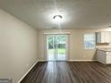 Spacious living area with sliding glass door leading to backyard at 1362 Mill Lake Cir, Stone Mountain, GA 30088