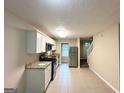 Functional kitchen with granite countertops, stainless steel appliances, and ample cabinet space at 2146 Wingfoot Pl, Decatur, GA 30035