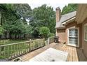 Wooden deck with grill overlooking a lush green backyard at 170 Glen Eagle Way, Mcdonough, GA 30253