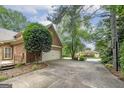 Long driveway leading to a two-car garage and a side entry to home at 170 Glen Eagle Way, Mcdonough, GA 30253