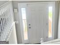 Welcoming entryway featuring a white door and side windows at 4411 Ward Bluff Ct, Ellenwood, GA 30294