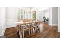 Elegant dining room featuring hardwood floors, natural light, and classic wainscoting at 1596 Fearn Ne Cir, Brookhaven, GA 30319