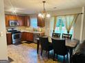 Cozy eat-in kitchen featuring stainless steel appliances and wood cabinets at 789 Winbrook Dr # 1, Mcdonough, GA 30253