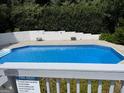 A sparkling in-ground pool with surrounding patio space for lounging and relaxation at 30 Highlands Ln, Oxford, GA 30054