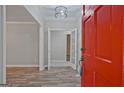 Bright foyer boasts wood-look floors, modern lighting, and french doors leading to another room at 3290 Ebenezer Se Rd, Conyers, GA 30094